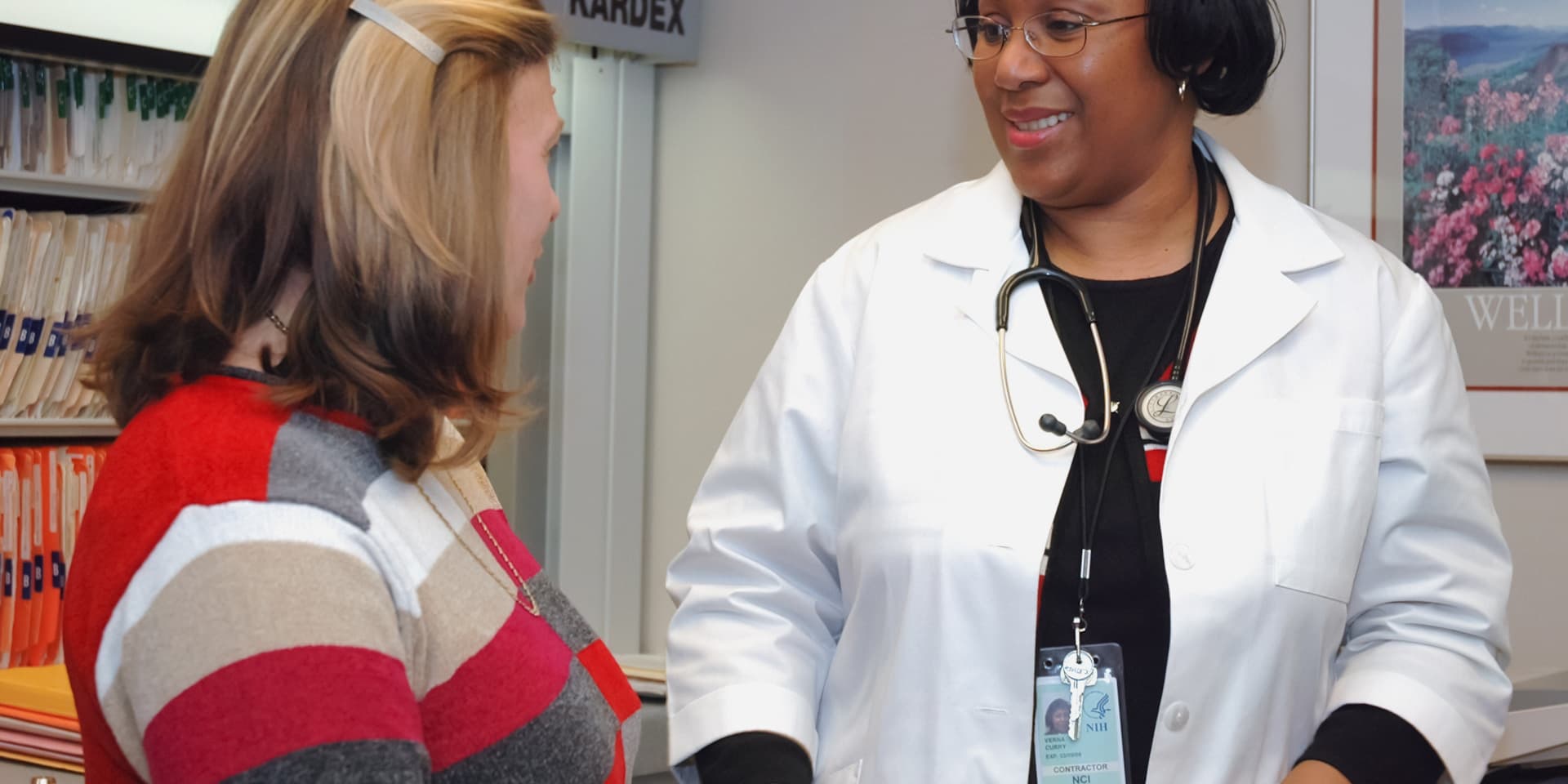 GP in consultation with patient and family